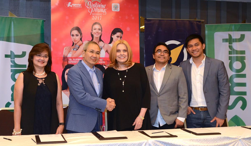 mart, Voyager sign an historic partnership with Binibining Pilipinas, powering the SMS voting for Filipino fans' favorite candidates. The winner of the SMS fan vote will automatically be included in the Top 15 finalists during the Grand Coronation Night at the Smart Araneta Coliseum on April 30. In photo are (from left) Uniprom, Inc. Chief Operating Officer Irene Jose, Smart Public Affairs Head Ramon Isberto, Binibining Pilipinas Charities, Inc. Chair Stella Márquez-Araneta, Voyager Chief Operating Officer Benjie Fernandez, and Voyager VP and Head of Voyager Business Dindo Marzan.